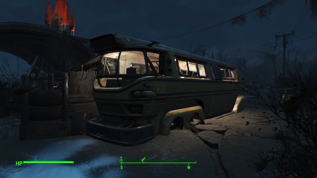 the exterior of a settlement's wall using a bus as part of the wall in fallout 4 at night
