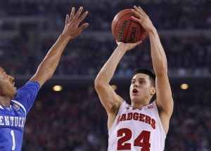 Wisconsin Badgers guard Bronson Koenig (24) scores against Kentucky Wildcats guard/forward James Young (1) during Wisconsin-Kentucky men's basketball game at the NCAA Final Four Semifinal, Saturday, April 5, 2014,  at AT&T Stadium in Arlington, Texas. Milwaukee Journal Sentinel photo by Rick Wood/RWOOD@JOURNALSENTINEL.COM